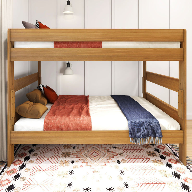 Modern wooden bunk bed with contemporary bedding and stylish patterned rug in a well-lit bedroom.
