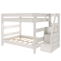 Whitewashed wood twin-over-full bunk bed with built-in storage staircase, guardrails and slatted platform frame — space-saving kids' bedroom solution