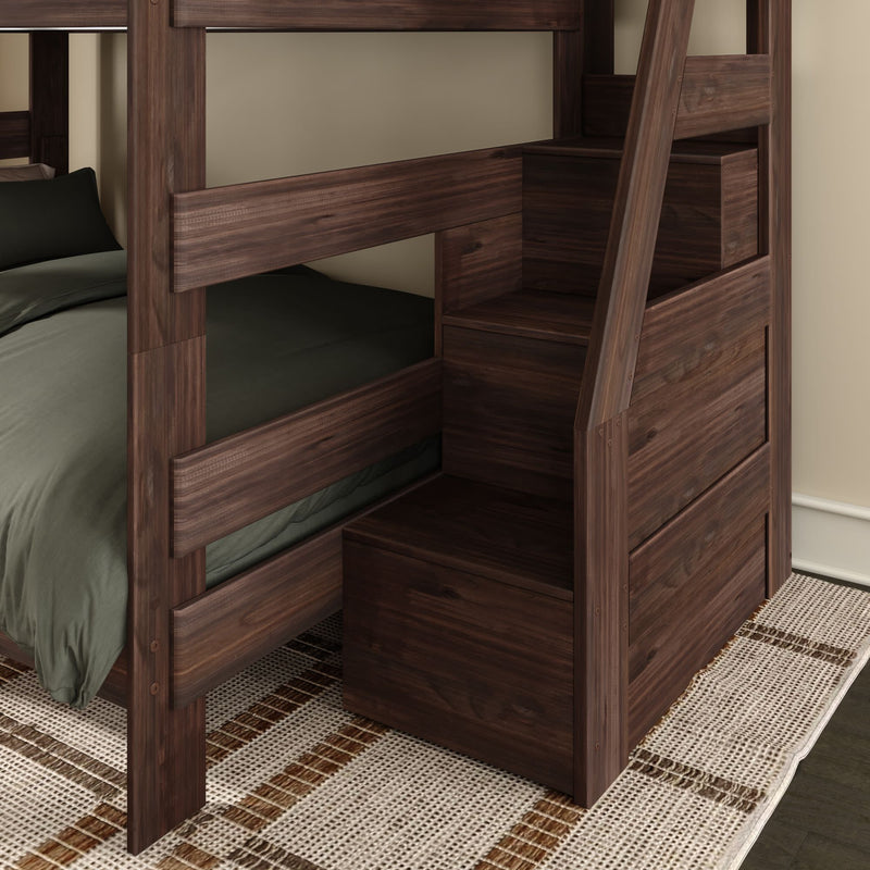 Dark walnut wooden bunk bed with built-in staircase storage drawers, green bedding and woven area rug in a modern bedroom