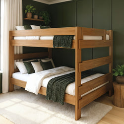 Wooden bunk bed with natural wood finish, green throws and pillows in a modern green-accent bedroom — sturdy solid-wood frame ideal for kids or guest rooms