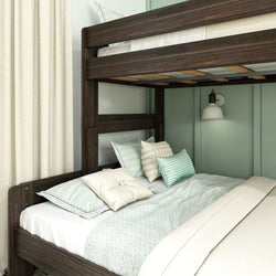 Bunk bed with dark wood frame, light green bedding, and decorative pillows in a cozy bedroom.