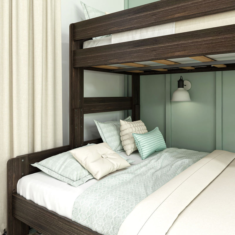 Bunk bed with dark wood frame, light green bedding, and decorative pillows in a cozy bedroom.