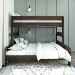 Stylish dark wood bunk bed with ladder in modern bedroom featuring soft bedding and decorative pillows.