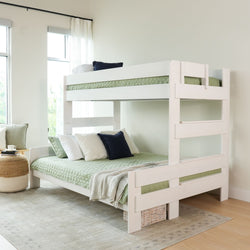White wooden bunk bed with green bedding in modern bedroom setting.