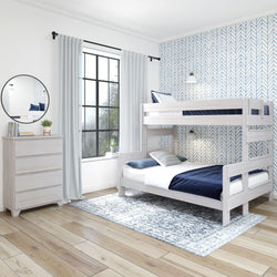 Modern white wooden bunk bed in a stylish bedroom with blue chevron wallpaper and hardwood floors.