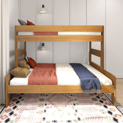 Wooden bunk bed with stylish bedding and modern lighting in a cozy bedroom.
