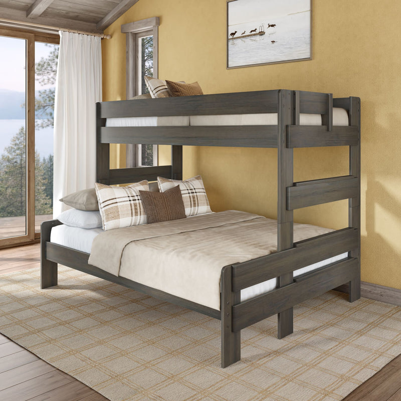 Rustic gray solid wood twin-over-full bunk bed with neutral bedding in cozy lakeview farmhouse bedroom