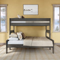 Modern gray wooden twin-over-full bunk bed in a cozy neutral bedroom with beige walls, plaid pillows, soft bedding, and lake-view windows