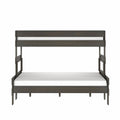 Modern dark gray wooden twin-over-full bunk bed with white mattresses, minimalist space-saving frame, front view on white background