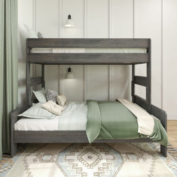 Bunk bed with green bedding and decorative pillows in a cozy bedroom setting.