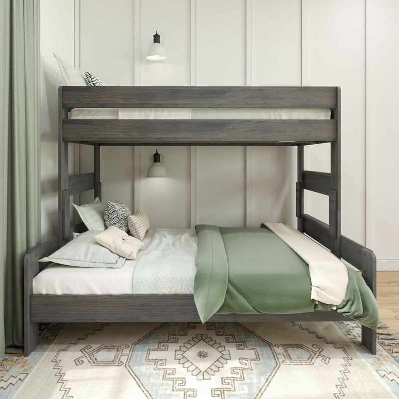 Bunk bed with green bedding and decorative pillows in a cozy bedroom setting.