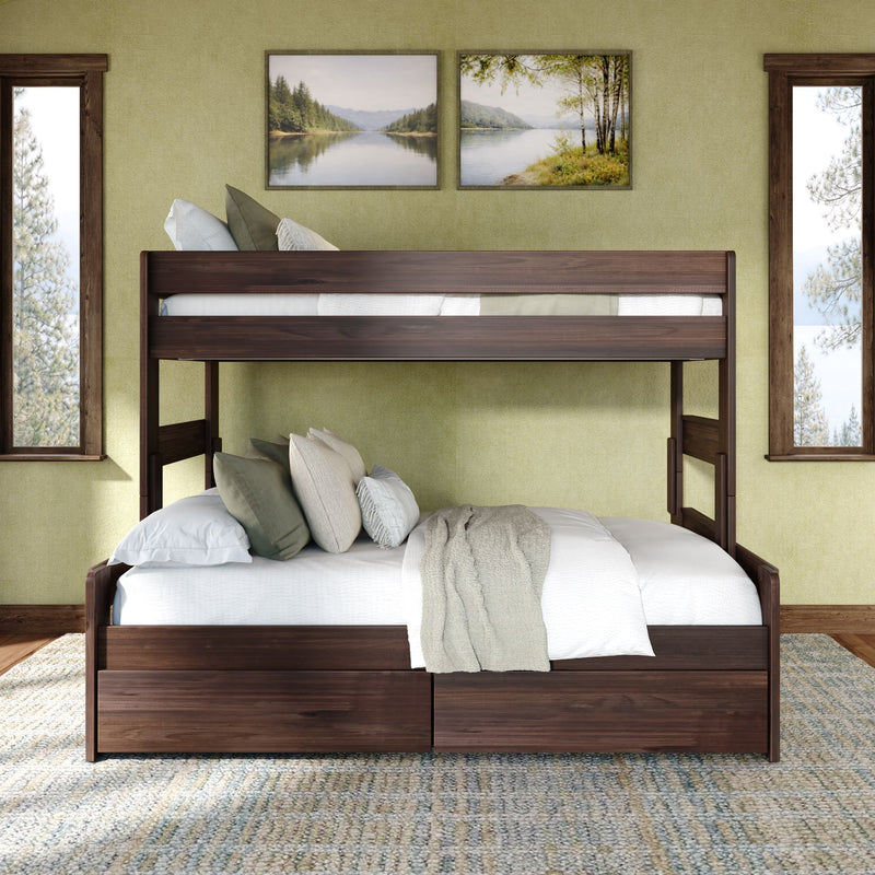Rustic wood bunk bed with under-bed storage and bedding in farmhouse bedroom with green accent wall, lake art and windows