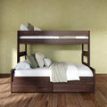Dark walnut bunk bed with white linens, green and beige pillows and a knit throw against an olive textured wall on hardwood floor