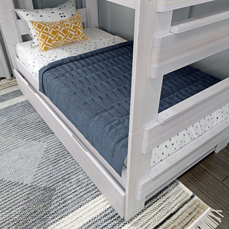 White wooden bunk bed with blue quilt and decorative pillows in a modern bedroom setting.