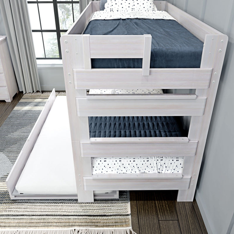 Wooden bunk bed with trundle in a modern bedroom featuring stylish bedding and natural light.