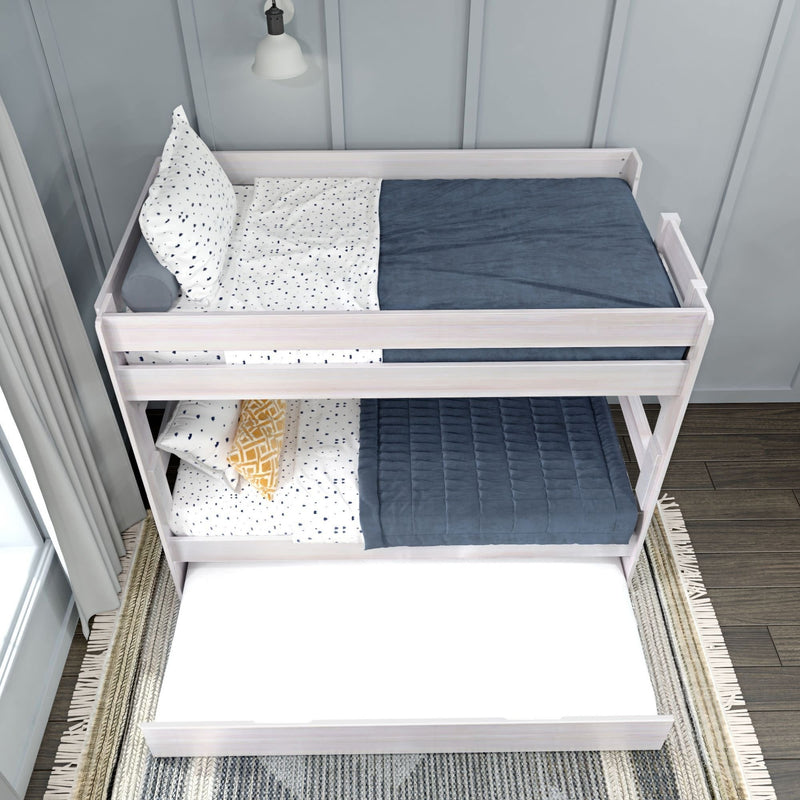 White wood bunk bed with blue and white bedding and trundle in modern bedroom.