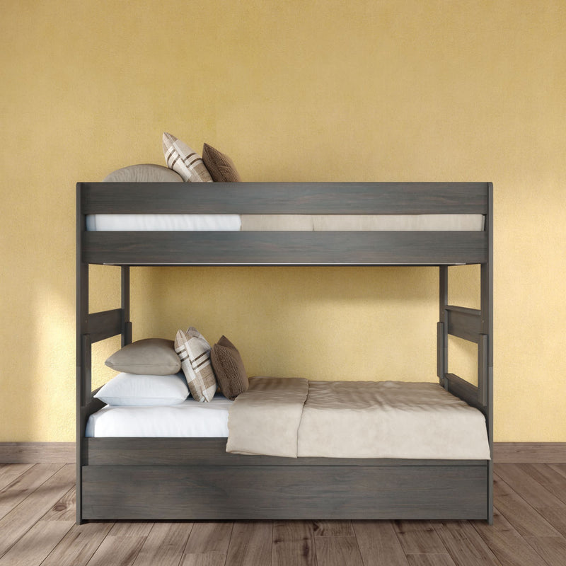 Modern dark wood bunk bed (twin-over-full) with beige bedding and plaid pillows against a yellow wall on hardwood floor — space-saving kids bedroom furniture