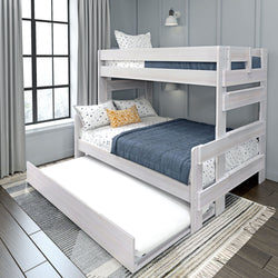 White wooden bunk bed with trundle, featuring navy and polka dot bedding in a modern bedroom setting.