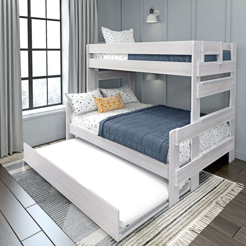 White wooden bunk bed with trundle, featuring navy and polka dot bedding in a modern bedroom setting.