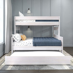 White modern bunk bed with navy bedding and polka dot pillows in stylish bedroom.