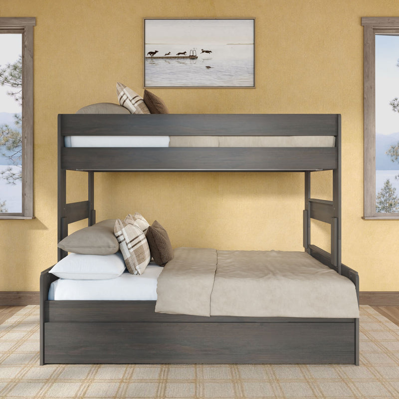 Dark gray wooden full-over-twin bunk bed in a modern rustic bedroom with beige bedding, plaid pillows, framed wall art and lake-view windows