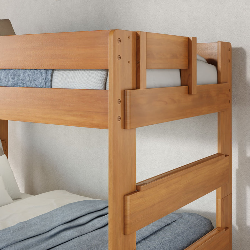 Close-up of solid wood bunk bed with honey natural finish, sturdy frame and safety rails, gray bedding — modern kids' wooden bunk bed