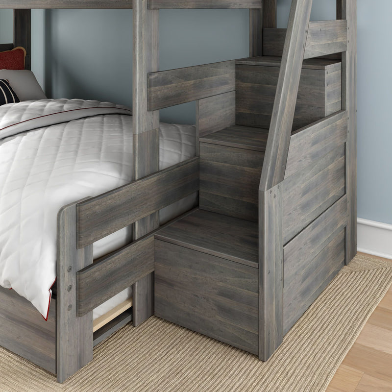 Gray wooden twin-over-twin bunk bed with storage staircase and under-bed drawers, white quilted bedding