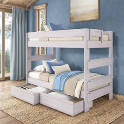 Whitewashed wooden twin-over-twin bunk bed with two under-bed storage drawers, blue and beige bedding, modern rustic space-saving kids' bedroom design