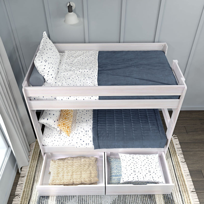 Modern wooden bunk bed with blue and white bedding and under-bed storage drawers in a stylish bedroom setting.