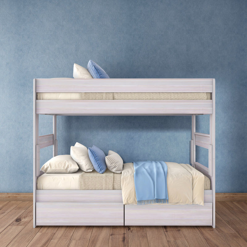 White wooden bunk bed with blue and cream bedding, pillows and under-bed storage against a textured blue wall