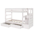 Whitewashed wooden loft bunk bed with built-in staircase storage, under-bed pull-out drawers and safety rails for a modern kids’ bedroom