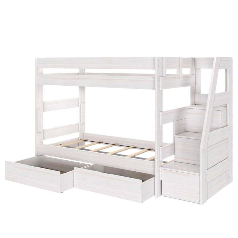 Whitewashed wooden loft bunk bed with built-in staircase storage, under-bed pull-out drawers and safety rails for a modern kids’ bedroom