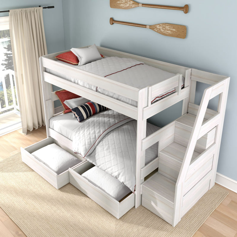 White wooden bunk bed with staircase and under-bed storage drawers in coastal-style kids' bedroom with oar wall decor