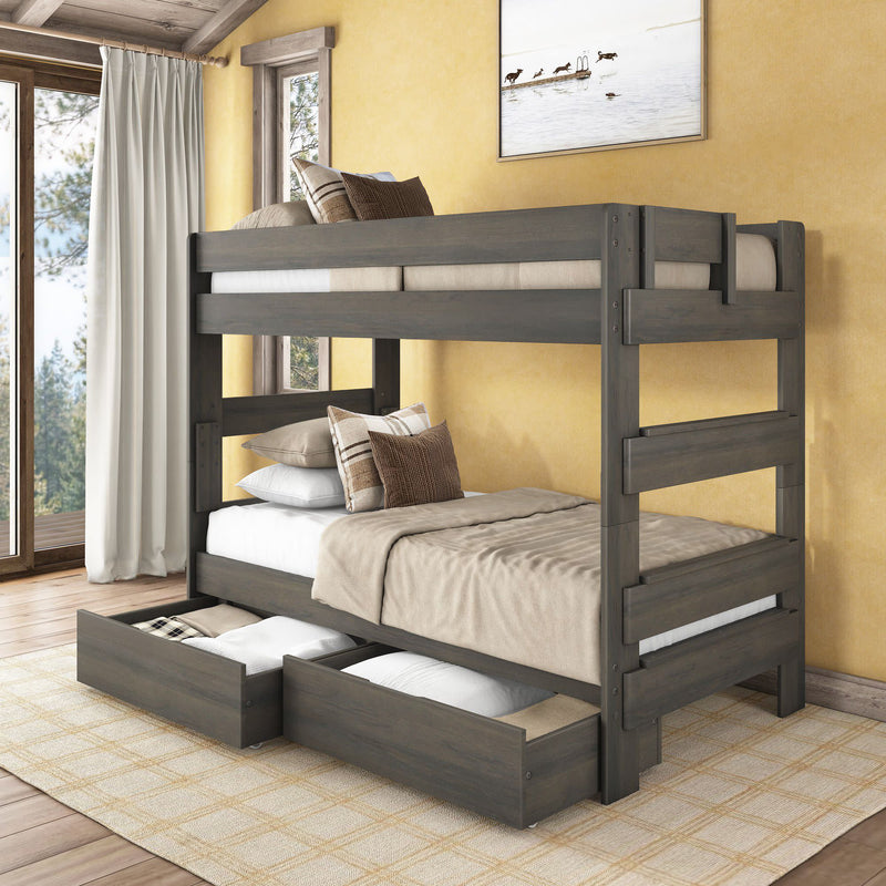 Gray solid wood twin-over-full bunk bed with pull-out underbed storage drawers, neutral beige bedding, built-in ladder in a cozy rustic bedroom with yellow walls and large windows