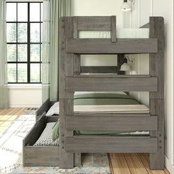 Wooden bunk bed with green bedding and natural light-filled room.