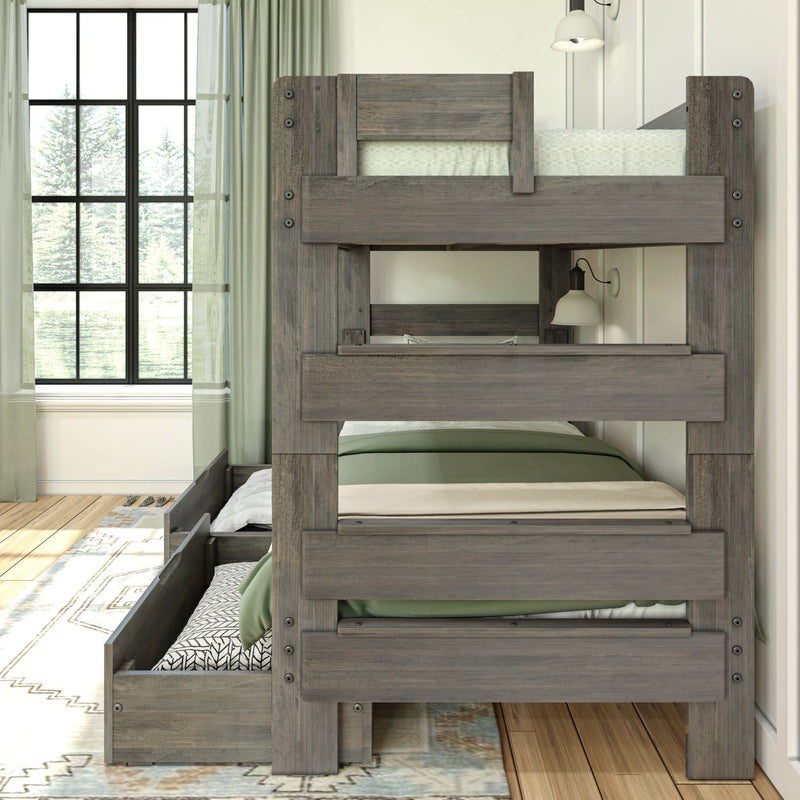 Wooden bunk bed with green bedding and natural light-filled room.