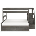 Gray wooden bunk bed with built-in staircase, under-bed storage drawers and white mattresses, space-saving loft bed for kids