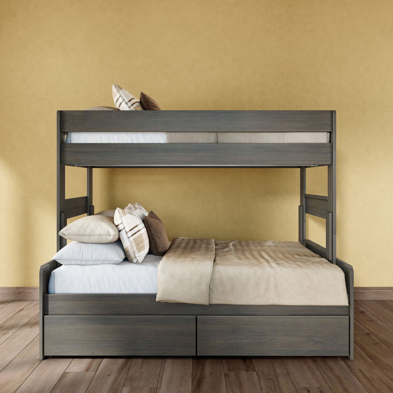 Modern grey wooden twin-over-full bunk bed with built-in storage drawers, neutral beige bedding and plaid pillows against a mustard yellow wall on hardwood floors — space-saving bedroom furniture
