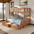 Wooden bunk bed with pull-out storage drawers, layered blue blankets and neutral pillows in a sunlit lakeside cabin bedroom with large windows and beige curtains