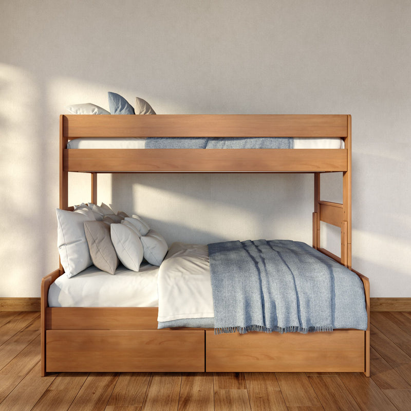 Minimalist wooden bunk bed with built-in storage drawers, white bedding and blue throw blanket, layered pillows on a sunlit hardwood-floor modern bedroom interior