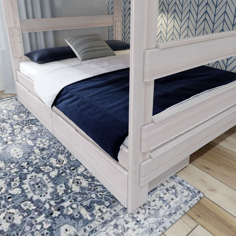 Modern wooden bunk bed with navy bedding and a decorative patterned rug in a stylish bedroom setting.
