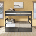 Dark wood twin-over-full bunk bed with under-bed storage drawers, beige bedding and plaid pillows in a sunlit rustic bedroom