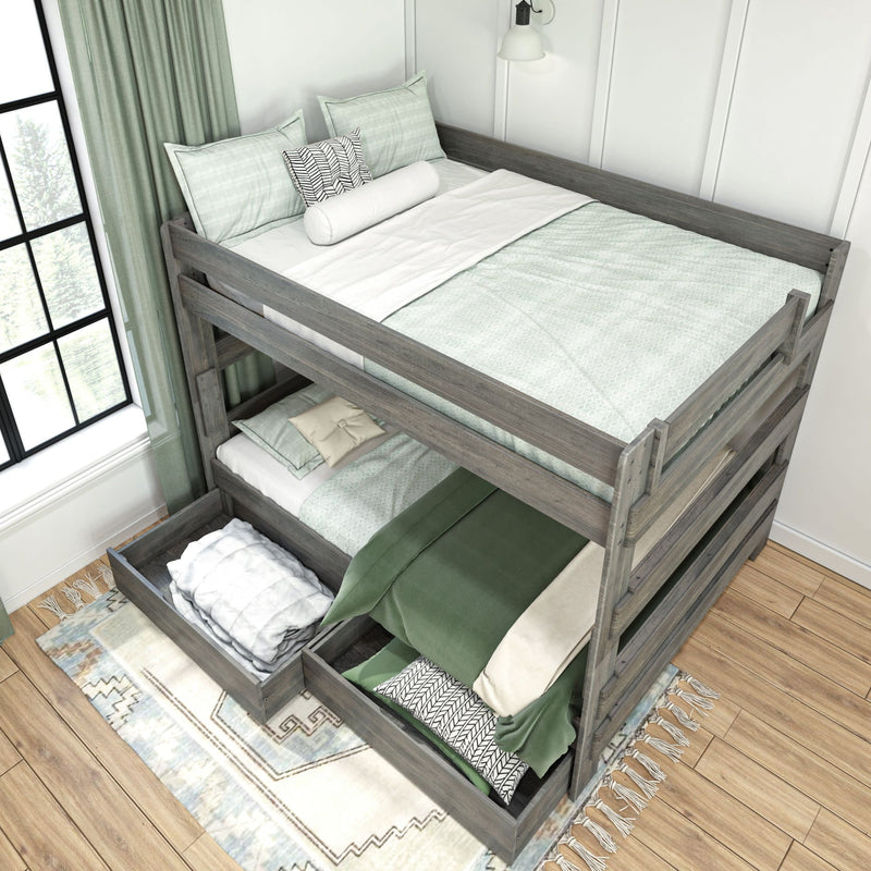 Wooden bunk bed with storage drawers, green and white bedding, in bright modern bedroom.