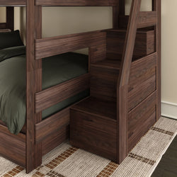 Walnut bunk bed with built-in staircase storage drawers and dark green bedding on lower bunk, modern bedroom furniture