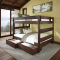 Dark walnut wooden bunk bed with under-bed storage drawers, white and green bedding in a rustic cabin bedroom with large lake-view windows — space-saving bunk bed ideal for small bedrooms