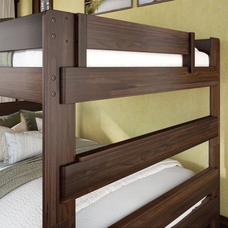 Solid dark walnut twin-over-twin wooden bunk bed with white bedding and textured pillows in a modern rustic bedroom interior