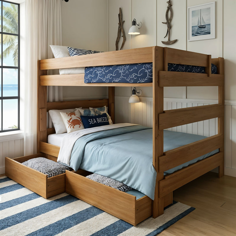 Coastal wooden twin-over-full bunk bed with light blue bedding, under-bed storage drawers and nautical decor in bright beach bedroom with ocean view