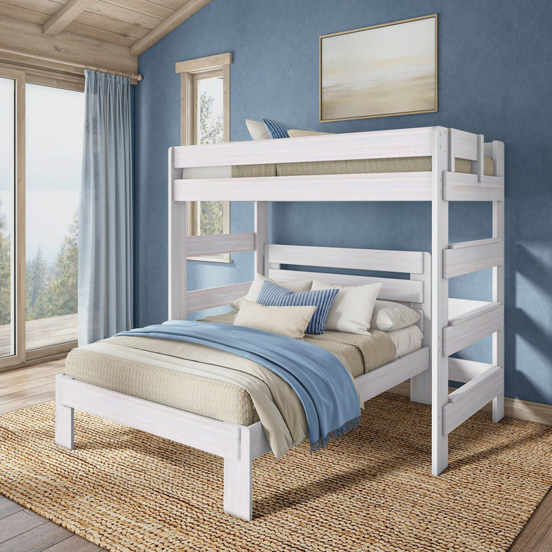 Whitewashed wooden twin-over-full bunk bed with blue and beige bedding in a coastal farmhouse bedroom with natural jute rug and large window view