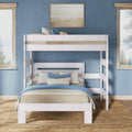 White wooden twin-over-full bunk bed in coastal blue bedroom with woven rug, layered bedding and decorative pillows — space-saving kids' bedroom furniture