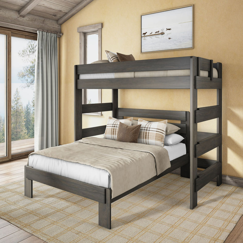 Full-over-twin gray solid wood bunk bed with built-in ladder and neutral bedding in a cozy modern farmhouse bedroom with plaid pillows and a large window overlooking a forest